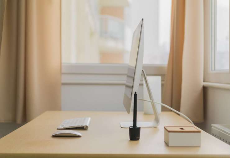 Clean and organized desk with computer in Las Vegas luxury home for sale.